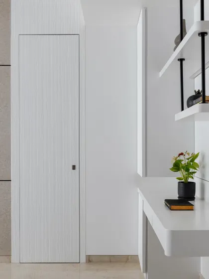 Another view of the hidden door, demonstrating how it blends perfectly with the surrounding wall for a clean, uninterrupted look.