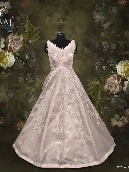 Be the epitome of grace in this light peach gown, crafted from organza tissue with an exquisite appliqué designer neckline.