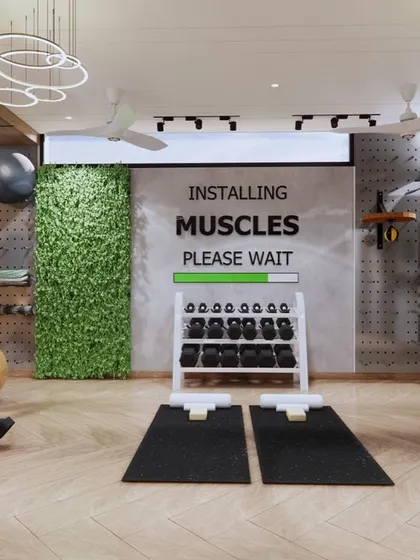 This home gym is designed to inspire. The space includes a dedicated area for weights with a motivational graphic on the wall, a vertical garden for a touch of nature, and state-of-the-art equipment.