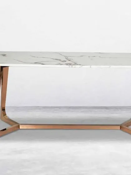 Another dining table option with a white marble top and a more streamlined rose gold metal base.