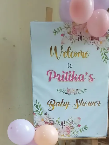 A personalized welcome sign is a great way to greet guests. This one was designed for Pritika's baby shower with a floral theme.