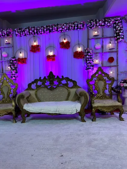 A detailed shot of the royal wedding stage, showing the ornate gold-finished sofa and chairs, perfect for the bride and groom.