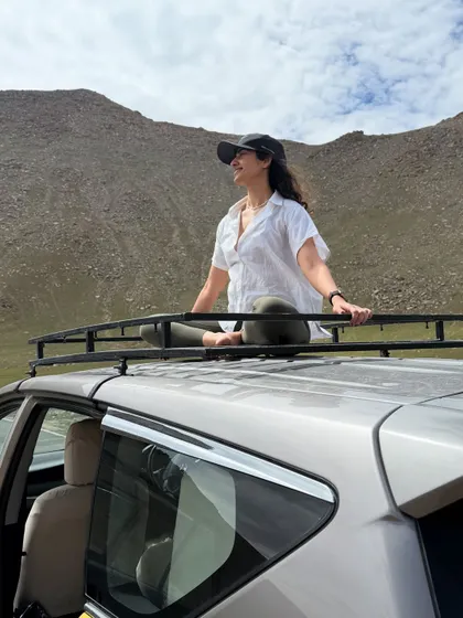 Finding a moment of stillness and a unique perspective on top of our car in the middle of the vast Ladakhi landscape. Adventure is everywhere.