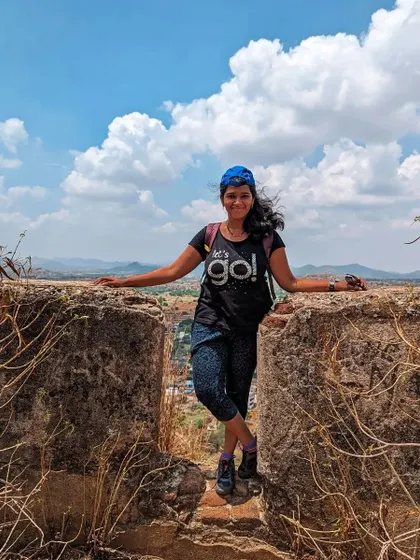 A happy trekker enjoying the view and the beautiful weather at Gudibande fort.