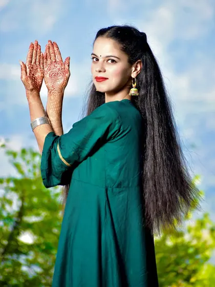 A lovely pre-wedding photo showcasing the bride-to-be's intricate mehndi design.