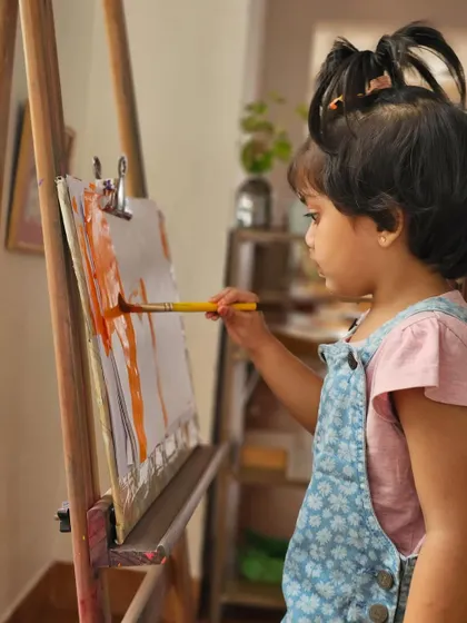 We nurture the artist in every child. At our easels, little hands are free to explore colors and express their creativity, developing focus and fine motor skills through process-based art.