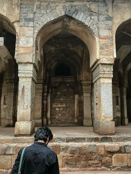 The stone arches of Lodhi Garden in Delhi, a quiet and contemplative space rich with history.