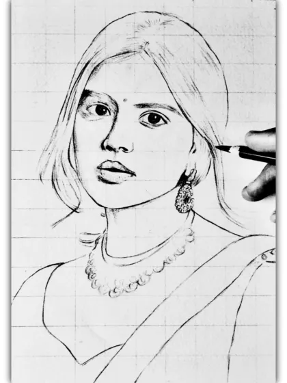The initial grid and outline sketch for the portrait of Kalyani Priyadarshan. This grid method helps me maintain accurate proportions as I begin the drawing.