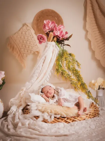 An example of our boho-themed sessions, featuring soft lace, natural textures, and delicate floral elements. We create these artistic, light-filled portraits for a timeless and elegant look.