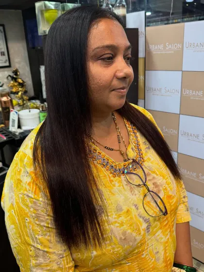A side profile showing the sleek finish of the Royal Nanoplastia treatment. This service is perfect for anyone wanting long-lasting straight hair without harsh chemicals.
