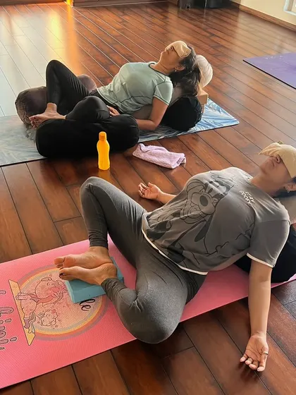 See how we use a combination of bolsters and blocks to create a fully supported restorative pose. This setup allows for complete muscular release and deep relaxation, which is vital for both mother and baby.