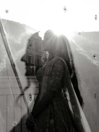 An artistic black and white double exposure. The silhouette of the groom is overlaid on a sunlit portrait of the bride, creating a poetic and symbolic image of their union during their pre-wedding shoot in Turkey.
