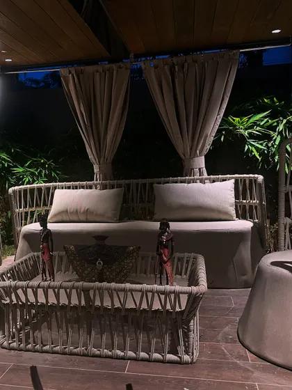 The front view of the pergola at night. The lighting from within makes it a stunning focal point in the garden after dark.