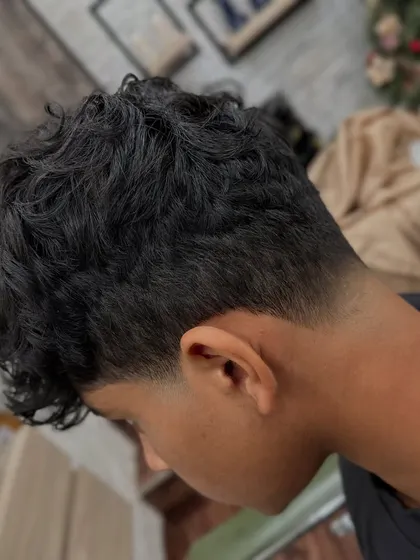Another angle of the taper fade, showing how it cleanly shapes the neckline. This kind of precision work is key to a long-lasting, great-looking men's haircut.