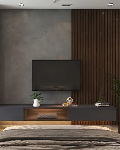 The TV unit in the same bedroom, combining dark grey cabinetry with a wooden louvered panel. The design is minimalist yet highly functional.