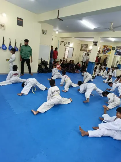 Students working on their flexibility during a class.