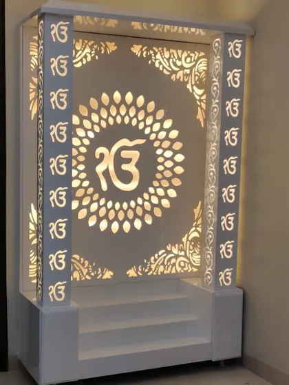The warm glow from the backlight makes this mandir a peaceful focal point in the evening.