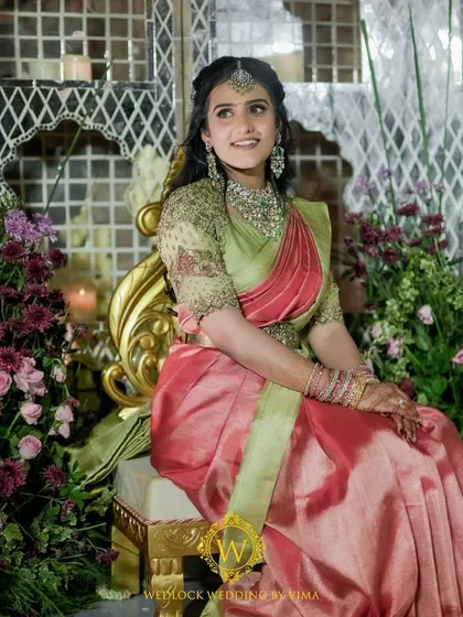 For this Varapuja ceremony, we used a vibrant palette of reds and pinks. The decor included hanging elephant charms and a mirrored backdrop to create a festive and prosperous atmosphere.
