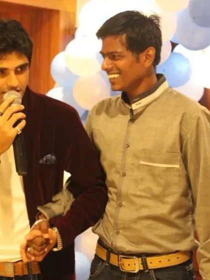 A candid moment of connection with a guest on stage. Building a good rapport with the audience is key to a successful and interactive event.