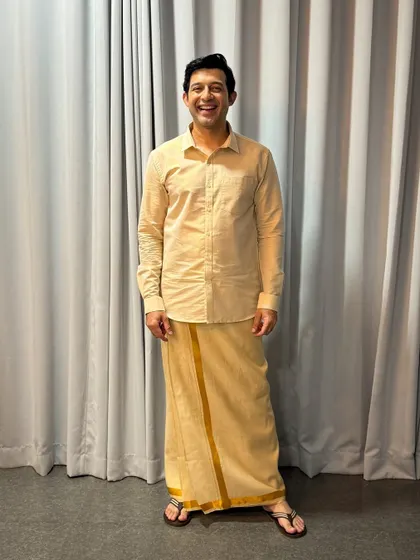 Versatility is key in this industry. Here, I'm dressed in a traditional veshti for a specific character role. I'm comfortable and experienced in adapting my look for shoots that require ethnic or traditional wear.