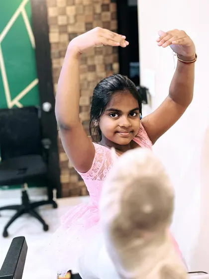 A young ballerina using a treadmill for advanced stretching exercises. I incorporate creative methods and equipment to help students safely improve their flexibility.