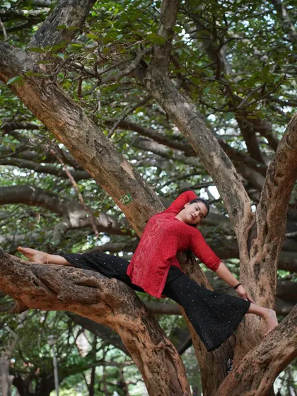 Finding my Hanumanasana (splits) in a tree. Practicing in nature adds a playful and grounding element to the challenge of deep flexibility poses.