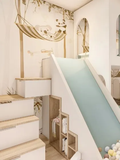 For this child's bedroom, the goal was to create a world of play and imagination. The design includes a custom bunk bed with an integrated slide that leads directly into a ball pit, along with clever storage solutions built into the stairs.