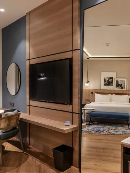 Additional views of the Radisson Resort, Khopoli, showcasing various interior and exterior details, from lobby seating areas and restaurant layouts to guest room configurations and architectural elements.