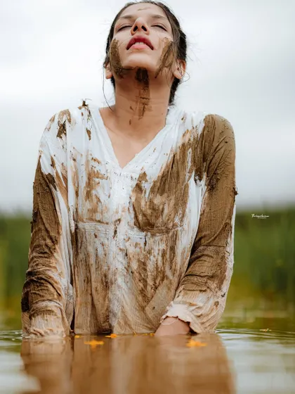 An expressive portrait from the paddy field series, focusing on the model's connection with the natural environment.