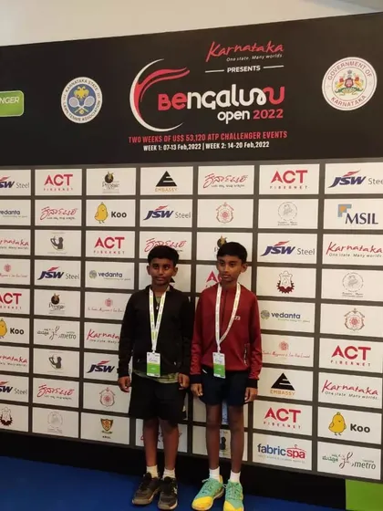 Our students posing in front of the official media wall, just like the pros. We create moments that motivate our players to aim for the professional tour.