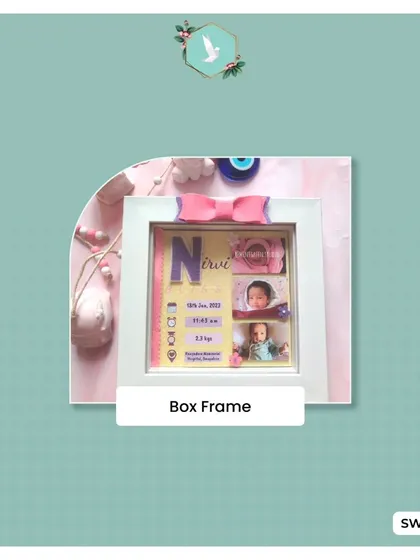 An example of our custom box frames, this one celebrating the arrival of a newborn. These 3D frames allow us to layer photos with birth statistics, names, and tiny charms for a truly one of a kind keepsake.