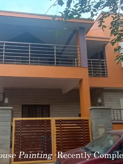 This recently completed exterior project for an independent house in Jakkur features a warm orange tone. The service also included enamel painting for the metal gate, ensuring all elements of the exterior are refreshed.