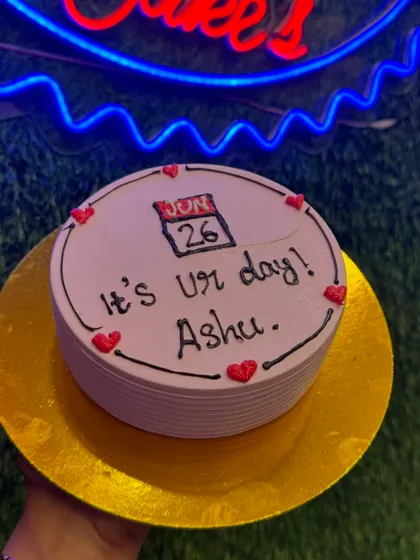 A special cake for a special day, with a calendar marking June 26th. The simple design with red hearts is a personal and heartfelt way to celebrate someone's birthday.
