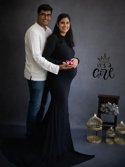 A creative announcement that "It's a Girl" using tiny pink shoes. This is a subtle and sweet way to share the gender of your baby.