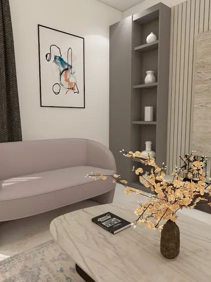 This view shows the balance in the room, with the TV unit on one side and a comfortable two-seater sofa and abstract art on the other.