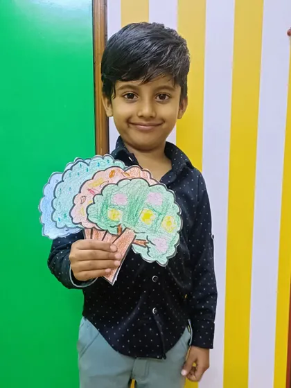 Another happy camper showing off the seasonal trees he colored.