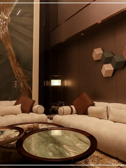 This living room showcases my love for rich textures and bold statements. The massive green marble slab on the wall serves as a piece of natural art, complemented by a plush, comfortable sofa and unique coffee tables.