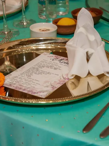 Another close-up of the elegant silver platter place setting, highlighting the thoughtful and luxurious guest experience.