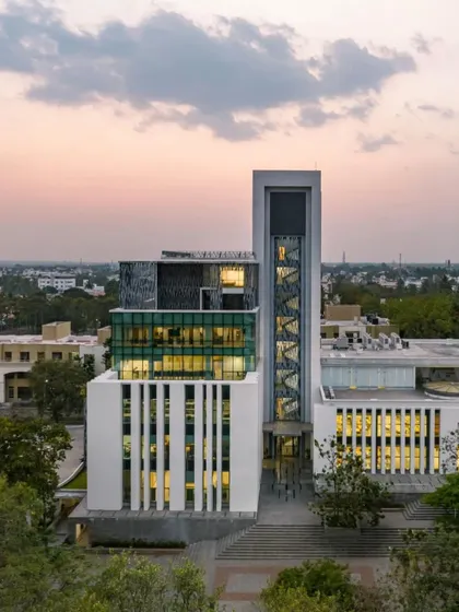 An evening view of the Sona University Centre, featured in ArchDaily. The lighting design highlights the building's modern form and its role as a beacon of innovation and learning on the campus.