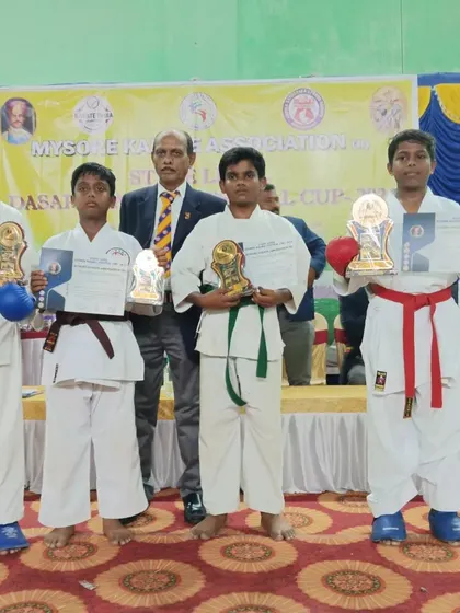 Students from different belt levels showcasing their wins at the Mysore Dasara Karate Festival Cup. Success is achievable for everyone who is dedicated.
