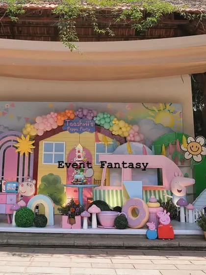 A slightly different angle of the expansive Peppa Pig setup, highlighting the train in the foreground and the detailed backdrop.