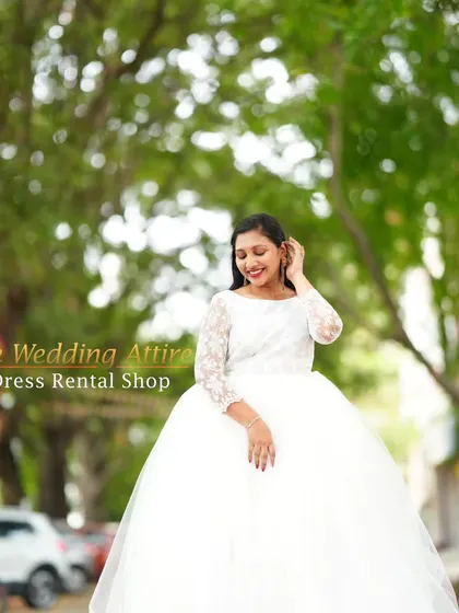 A smiling portrait in the classic white ball gown.