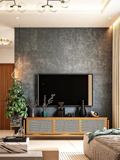 A minimalist living room design featuring a textured grey feature wall and a cane-front media console. This combination of rustic and industrial elements creates a relaxed yet stylish space.