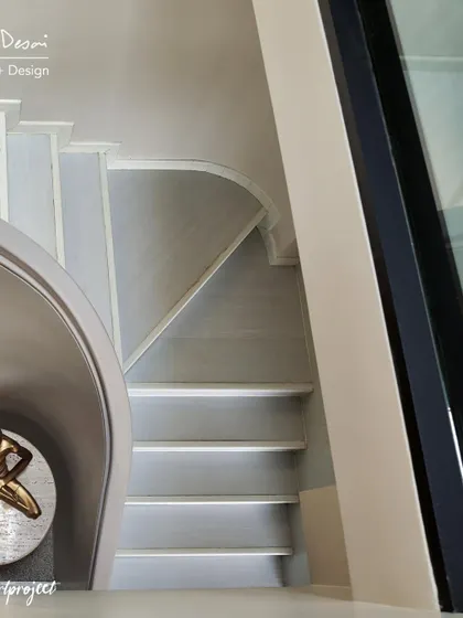Another view of the "Agra Fort" staircase and mandir niche. The design proves that a sacred space can be beautifully integrated into a modern home's architecture.
