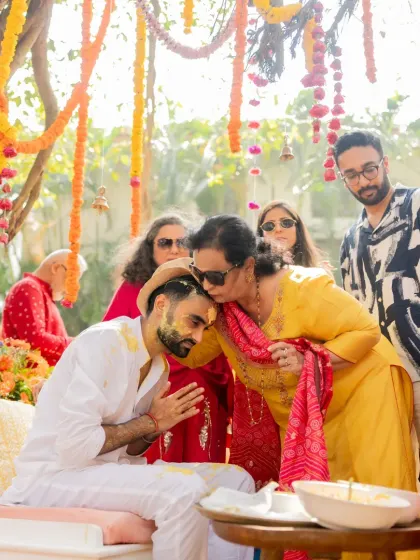 The groom receiving blessings from his family. I coordinate the event flow to allow for these meaningful and traditional moments.