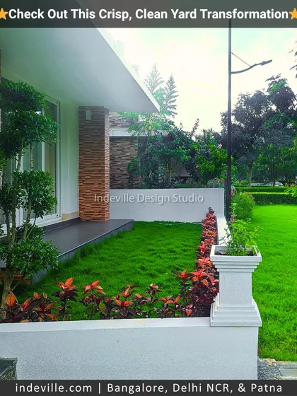 Another angle of the front yard, showing the clean lines of the raised planter and the contrast between the red foliage and the green lawn. This demonstrates my focus on creating structured and visually appealing landscapes.