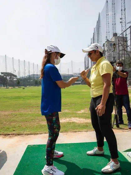 Explaining the feel of a proper golf grip to a new student. A solid grip is the foundation of every good golf shot.