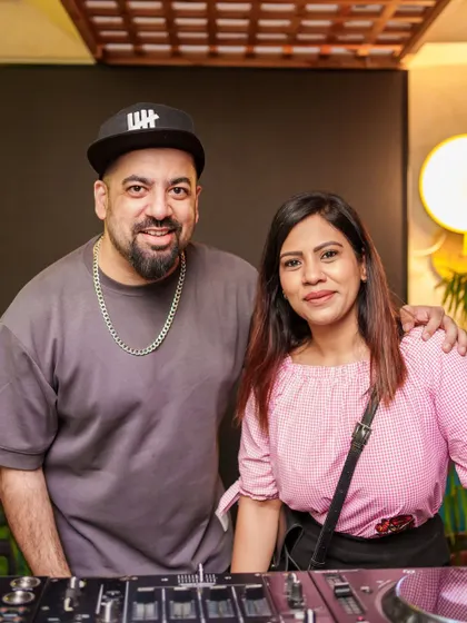 Posing with a fan behind the decks. I love connecting with the people who come out to support and enjoy the music.