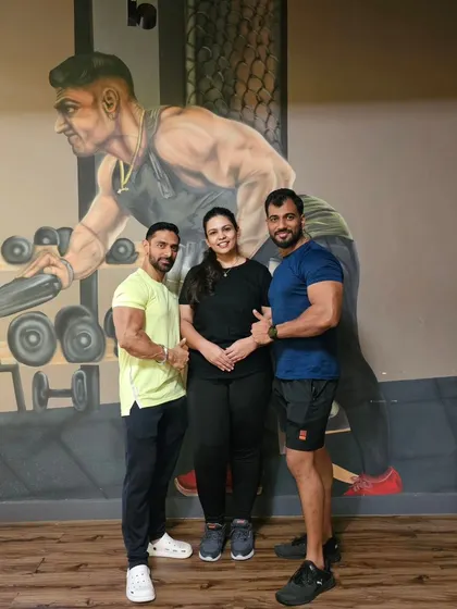 Posing with my client and her trainer to celebrate her amazing progress. Teamwork is key to achieving great results.