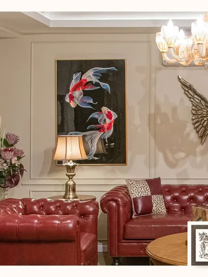 The captivating koi fish wall art in this living room adds a touch of serenity and charm. The dark background makes the vibrant reds and whites of the fish stand out beautifully.
